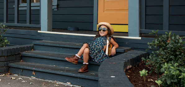 girl on stairs with sunglasses